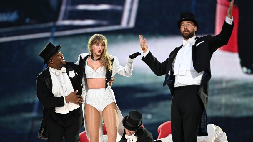 LONDON, ENGLAND - JUNE 23: (EDITORIAL USE ONLY. NO BOOK COVERS) EXCLUSIVE ACCESS. Taylor Swift is joined on stage by Travis Kelce (R), during "Taylor Swift