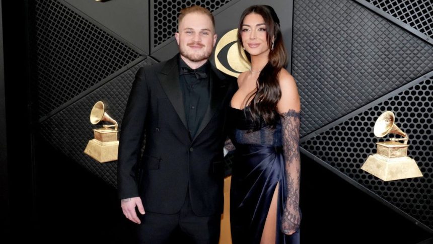 LOS ANGELES, CALIFORNIA - FEBRUARY 04: (FOR EDITORIAL USE ONLY) (L-R) Zach Bryan and Bri LaPaglia attend the 66th GRAMMY Awards at Crypto.com Arena on February 04, 2024 in Los Angeles, California. (Photo by Jeff Kravitz/FilmMagic)